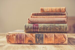 shallow focus photography of stack of books